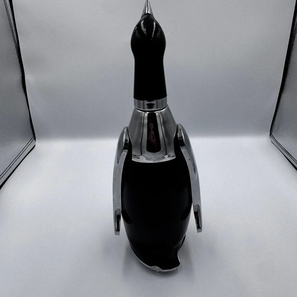 PENGUIN BOTTLE DECANTER MUSIC BOX PLAYS 